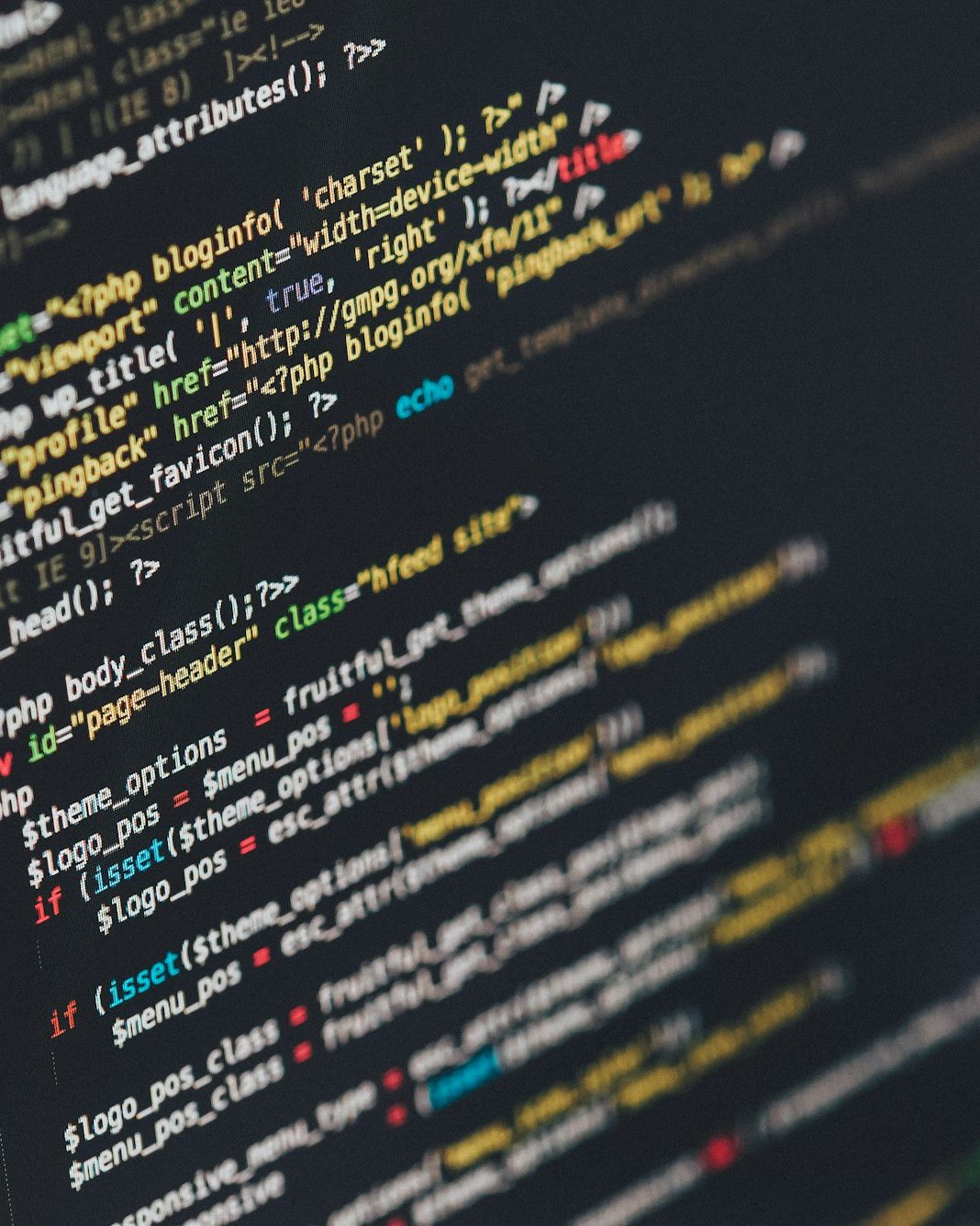Close view of HTML and backend code on a laptop screen